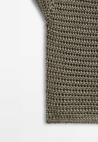 Woven textile piece featuring a grid-like pattern in earthy tones, showcasing a textured finish and a loose, airy design.