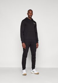 Björn Borg ESSENTIAL HOODIE - Jersey con capucha - black beauty