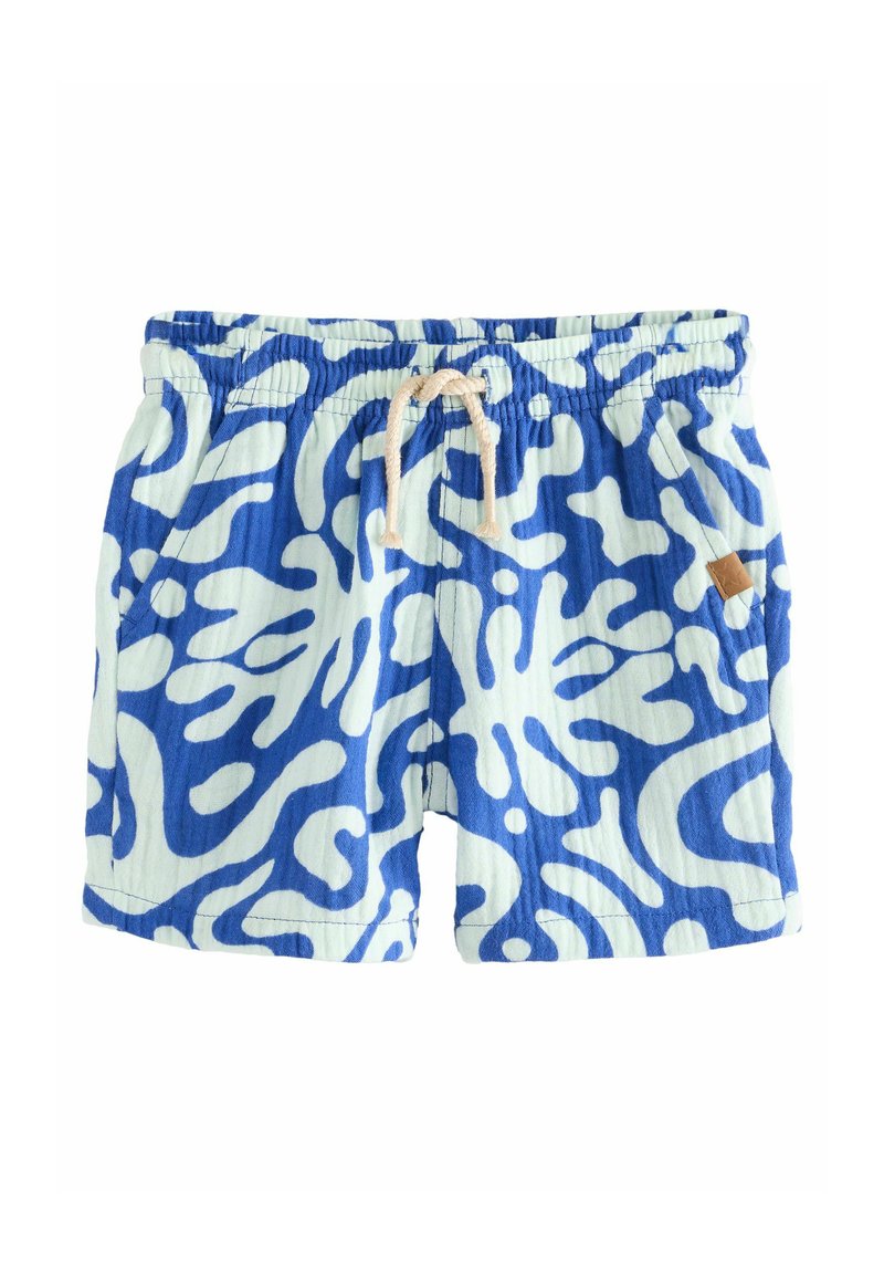 Shorts de bain bleus et blancs présentant un motif abstrait en vagues, une taille élastique avec cordon de serrage et une petite étiquette en cuir de la marque.