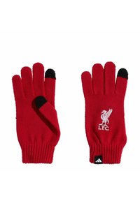 Crvene pletene rukavice s crnim vrhovima prstiju i rebrastim manžetama. Imaju bijeli logo Liverpool nogometnog kluba na zapešću.