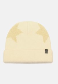 Cream-colored beanie made of soft knit fabric, featuring light tan star patterns and a black label sewn on the cuff.