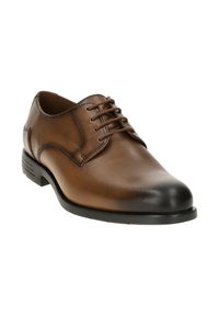 Chaussure habillée en cuir marron avec un design à lacets, bout arrondi, semelle en caoutchouc noir et texture lisse. Présente des détails de couture discrets.