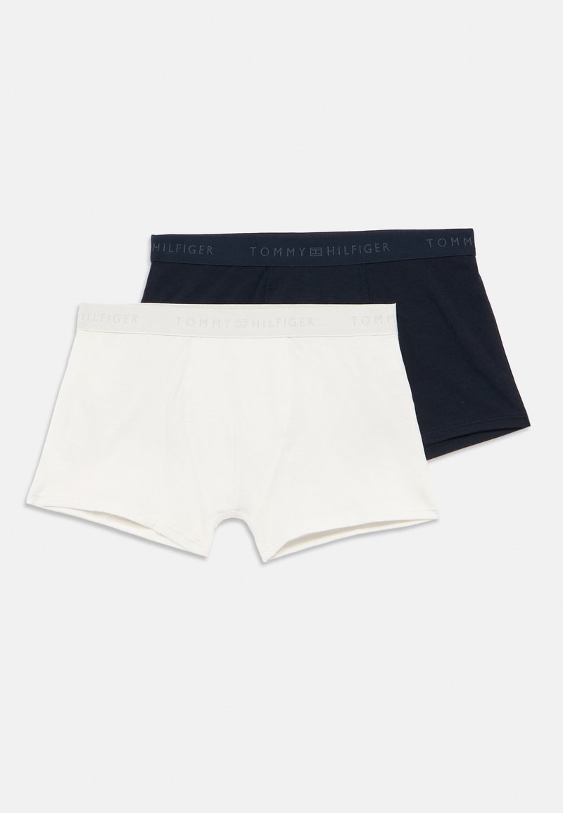 Two pairs of Tommy Hilfiger boxer shorts; one white and one navy. Each has a branded elastic waistband with visible stitching detail.
