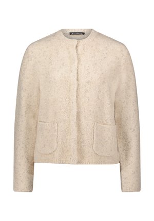 Veste beige texturée avec encolure ronde, patte de boutonnage à l'avant et deux poches plaquées. Tissu doux avec un léger éclat, idéal pour superposer.