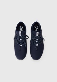Navy mesh athletic shoes with white accents, featuring round laces with a navy and white pattern, cushioned sole, and pull tab on the heel.