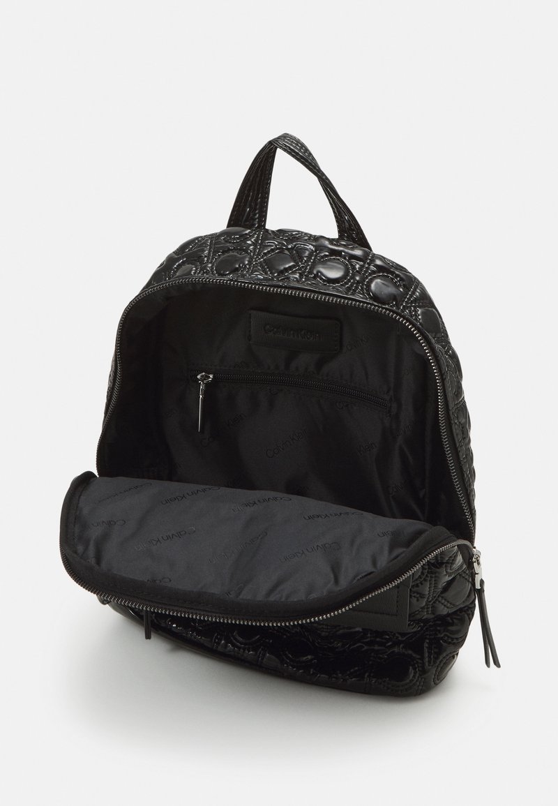 calvin klein quilted backpack leather Zulle Organizational Backpack, Caramel, One Size Dual rolled carrying handles with detachable Calvin Klein Reyna Novelty Key