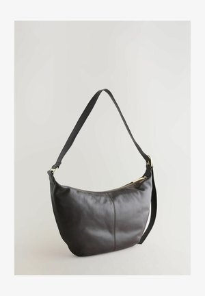 Tumedast pruuni nahast õlalauk, millel on kõver kuju, sile pind ja kuldne tõmblukk. Rihm on must ja reguleeritav.