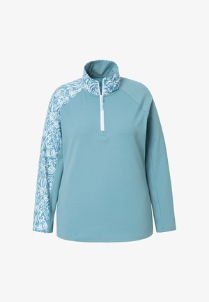 Jasnoniebieski sweter z ćwierć zamkiem, z wzorzystym białym wzorem na jednym rękawie. Wykonany z gładkiego, elastycznego materiału.