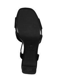 Sandalia negra con suela de goma plana y lisa. Presenta un diseño elegante con una correa para mayor soporte, texturizada para ofrecer agarre y durabilidad. Talla 37.