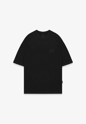 Schwarzes, übergroßes T-Shirt mit kurzen Ärmeln, rundem Ausschnitt und einem dezenten Logodetail in der oberen linken Ecke. Glattes Baumwollmaterial.
