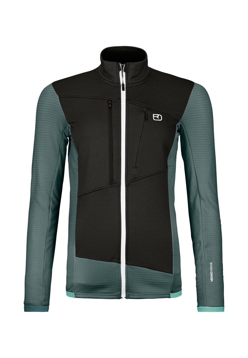 Schwarze und türkisfarbene Jacke mit hohem Kragen, Reißverschlusstaschen, strukturierten Ärmeln und einem markanten geometrischen Design. Enthält weiße Reißverschlüsse.