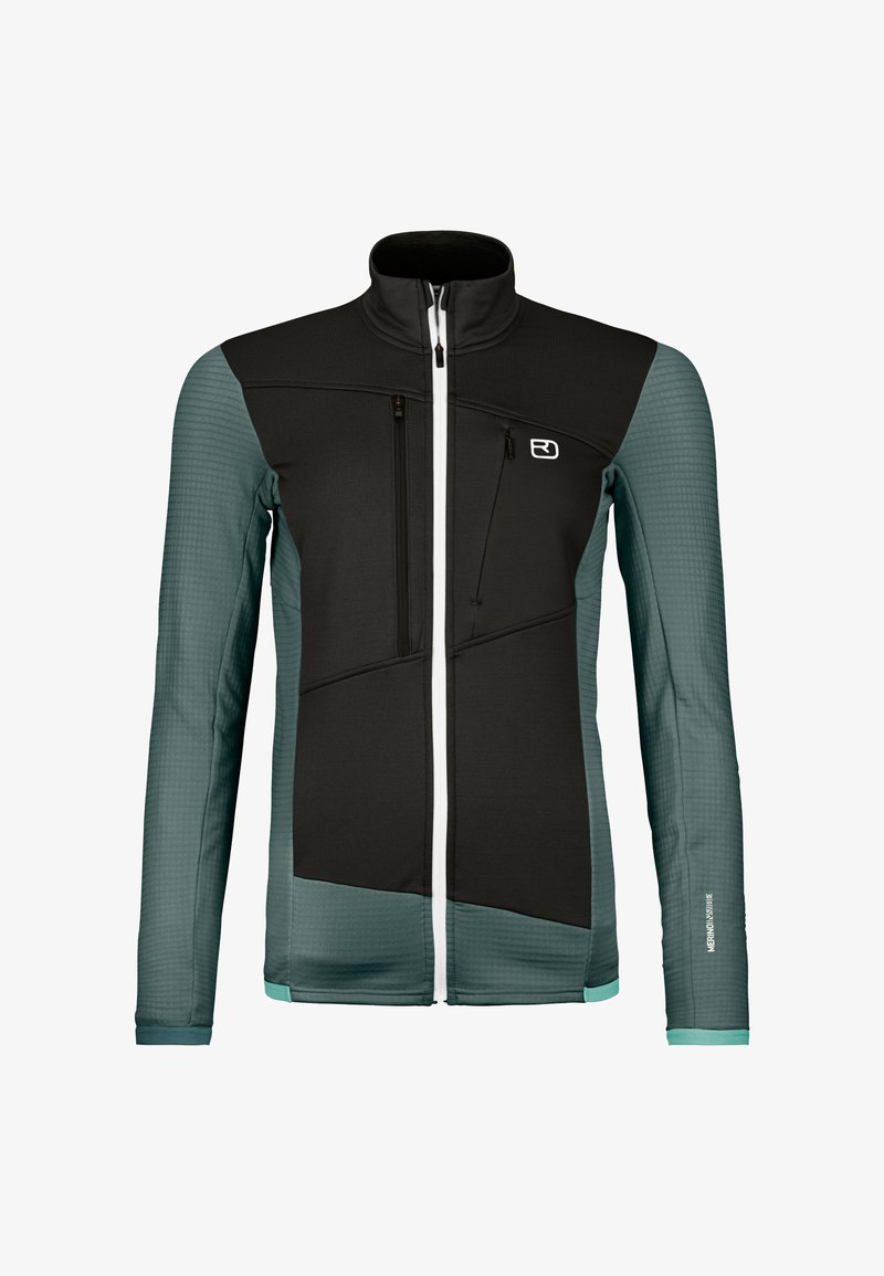 Schwarze und türkisfarbene Jacke mit hohem Kragen, Reißverschlusstaschen, strukturierten Ärmeln und einem markanten geometrischen Design. Enthält weiße Reißverschlüsse.