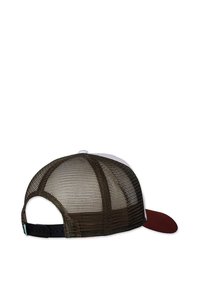 Brown mesh trucker cap with a white front panel and a red curved brim. Adjustable strap at the back, featuring a textured surface.