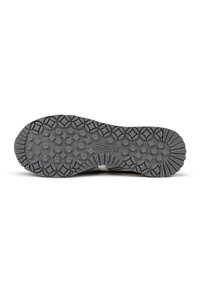 Black sneaker sole with textured grip and circular patterns, featuring a white accent stripe and "MUNICH" branding. Durable rubber material.