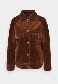 Giacca di velluto a coste marrone con colletto, chiusura con bottoni e due tasche frontali. Presenta una superficie testurizzata e un design a vestibilità rilassata.