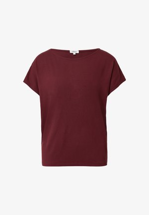 Burgundia lühikeste varrukate ja pehme puuvillaga T-särk. Omab vabalt lõigatud vormi ja ümmargust kaelust, millel on õmmeldud äär ja külgmised lõhikud.