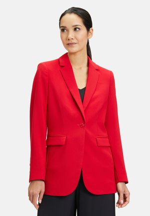 Red blazer with notch lapels, single button closure, two front pockets, and long sleeves. Tailored fit in a smooth, textured fabric.