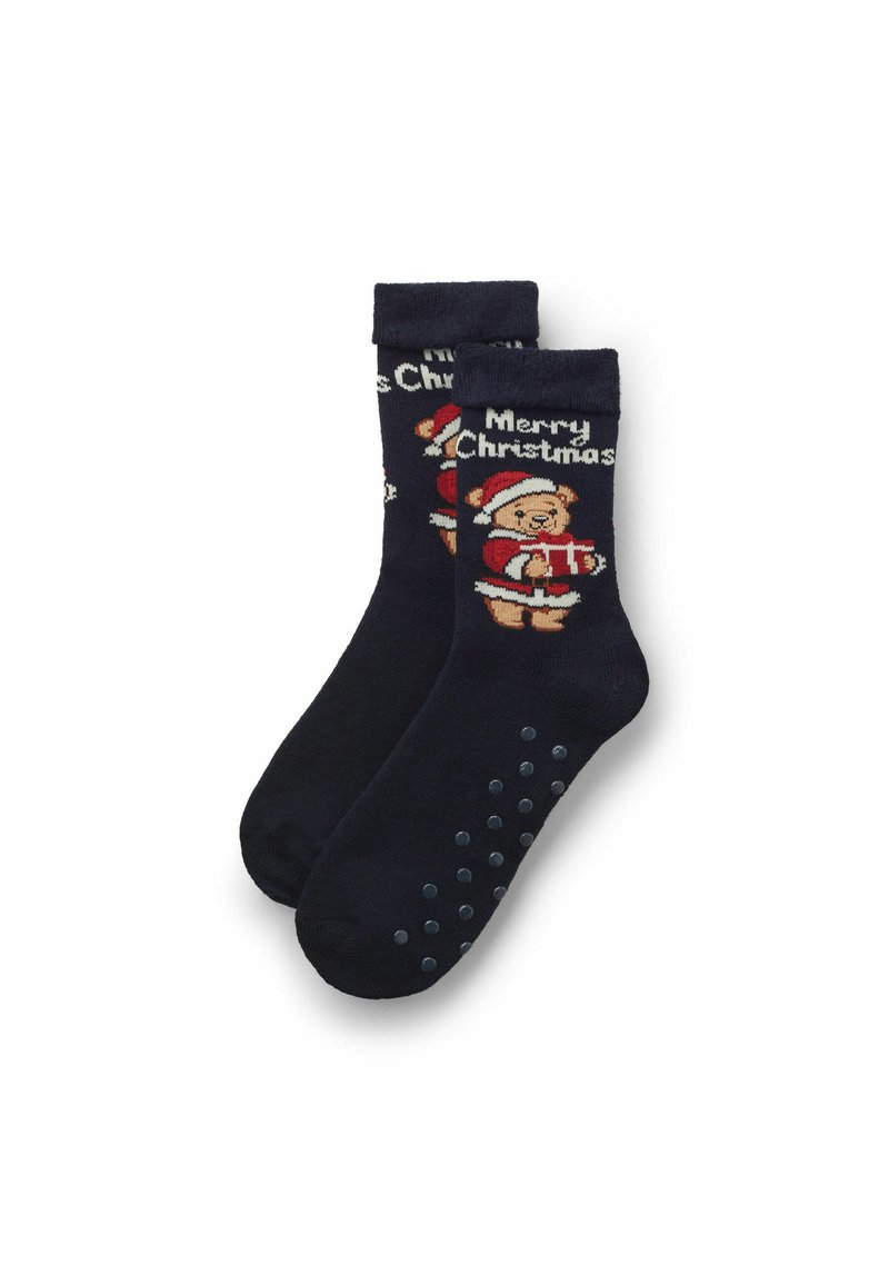 Navyblaue Socken mit einem Teddybär in einem Weihnachtsmannhut, der ein Geschenk hält, und dem Text "Frohe Weihnachten". Mit gummierten Griffpunkten an den Sohlen.