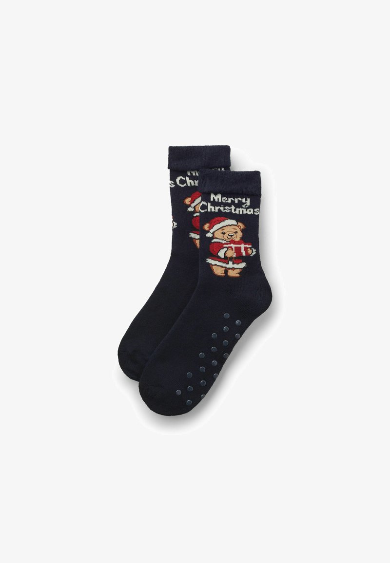 Navyblaue Socken mit einem Teddybär in einem Weihnachtsmannhut, der ein Geschenk hält, und dem Text "Frohe Weihnachten". Mit gummierten Griffpunkten an den Sohlen.