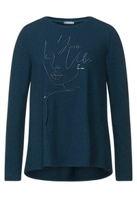 Mörk teal långärmad sweatshirt med en linjetecknad ansiktsdesign och texten "Your Vibe" och "Life is Beautiful", tillverkad av ett mjukt tyg.