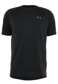 Svart sportt-shirt i lättviktig tyg, med korta ärmar, rundad nederdel och en diskret grå logotyp på bröstet.