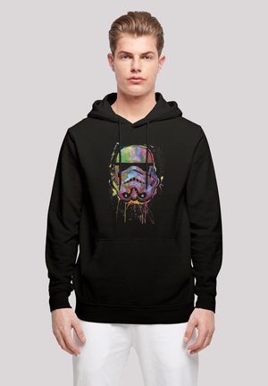 Svart hettegenser med et fargerikt, stilisert stormtrooper-hjelmdesign, justerbare snorer og en frontlomme.