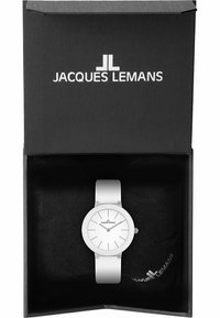 Weißer Uhren mit minimalistischem rundem Zifferblatt und Armband, präsentiert in einer schwarzen Box mit weichem Innenfutter. Hat silberne Zeiger und Stundenmarkierungen.