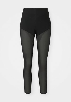Schwarze High-Waist-Leggings mit semi-transparenten Mesh-Einsätzen an den Oberschenkeln und Unterschenkeln, nahtloses Design, enganliegende Silhouette.