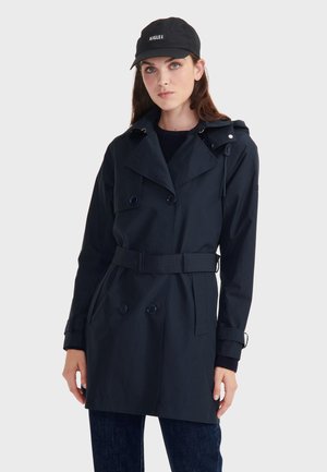 Navy waterproof trench coat with double-breasted buttons, belted waist, and hood. Features a smooth texture and fitted design.