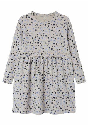 Langærmet beige kjole med i taljen, pyntet med små blå og sorte blomsterprint over det hele.