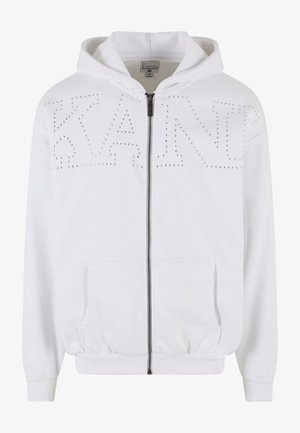 White zip-up hoodie with a hood, made of soft fabric. Features studded lettering "KANT" on the front and side pockets. Elastic cuffs and hem.