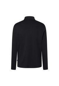 Långärmad polotröja i solitt svart, med klassisk krage, mjuk textur och skräddarsydd passform. Enkel och mångsidig design.