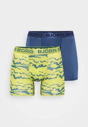 Two pairs of boxer shorts: one in navy blue, the other in neon yellow with a cloud pattern in green and a logo waistband. Soft, stretchy material.