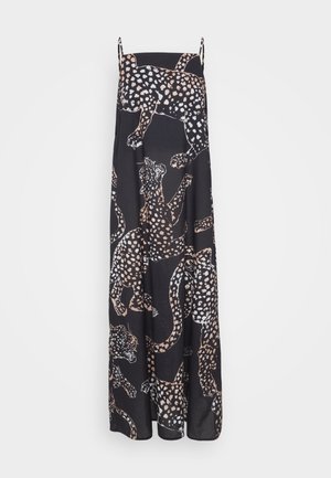 Maxi dress in black fabric featuring a leopard print design in white and tan. Spaghetti straps; loose, flowing shape; smooth texture.