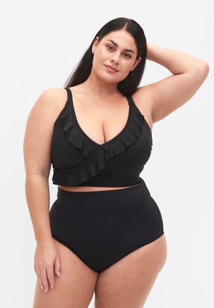 Čierny bikini set s volánovým prekrytím a vysoko pásovými nohavičkami. Hladká textúra s nastaviteľnými ramienkami.