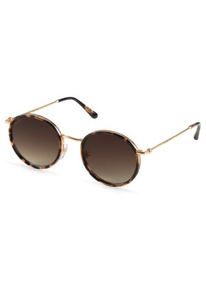 Lunettes de soleil rondes avec une monture en écaille de tortue, des accents dorés et des verres bruns dégradés. Design l�éger avec des branches en métal fines.