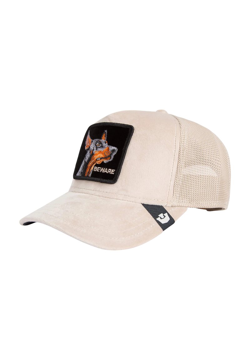 Beige pet met een gestructureerde afwerking, voorzien van een zwart rechthoekig label met een hondenafbeelding en de tekst "BEWARE". Zijpanelen van mesh voor ventilatie.