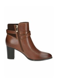 Botine din piele maro, cu vârful ascuțit, fermoar pe lateral și accente elastice cu nervuri; prezintă un toc de înălțime medie, stratificat.