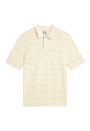 Beige short-sleeve polo shirt with a textured wave pattern and a two-button placket collar.