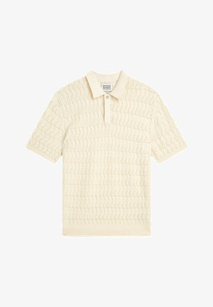 Beige short-sleeve polo shirt with a textured wave pattern and a two-button placket collar.