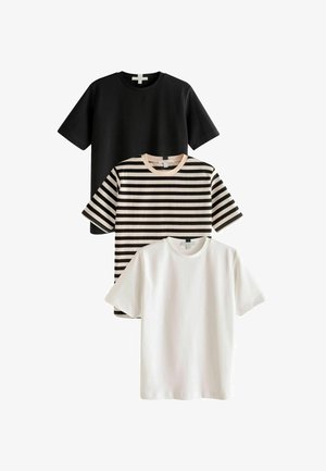 Three T-shirts: one black, one white, and one striped in black and beige. All feature short sleeves and crew necks, made from smooth fabric.