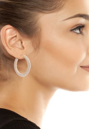 Circular hoop earrings with three rows of small clear beads, featuring a silver-tone metal setting, reflecting light with a glossy finish.