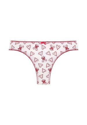 Weißer Tanga mit rotem Zuckerstangen- und Herzmuster, elastischem Bund und dekorativem pinken Bogen vorne. Mit roter Naht verziert.