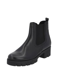 Czarne skórzane botki Chelsea z elastycznymi panelami po bokach, zaokrąglonym noskiem oraz grubą gumową podeszwą z niewielkim obcasem i teksturowanym bieżnikiem.