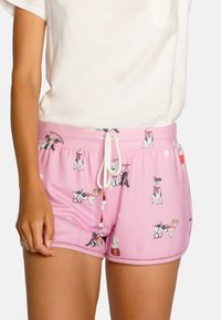 Roze katoenen shorts met hondillustraties, witte trekkoord en zakken. Kenmerkt zich door een zachte textuur en speelse, kleurrijke huisdierontwerpen.