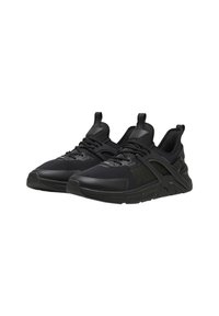 Scarpe sportive nere con tomaia in rete testurizzata, tallone rinforzato e suola in gomma. Presentano un design minimalista e accenti di logo discreti.