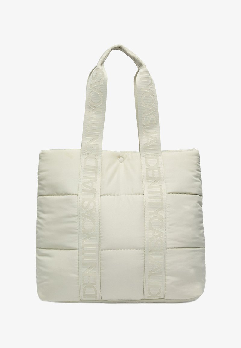 Padded tote bag in light beige fabric with matching reinforced handles. Features a quilted design and embossed logo on handles.