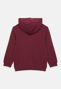 Sweatshirt burguês sólido com mangas longas, punhos e bainha canelados, mostrado por trás em fundo branco.