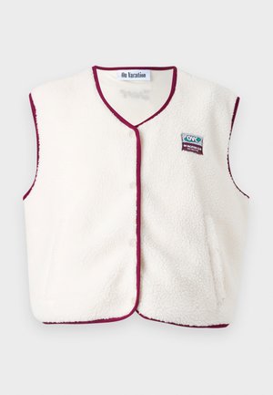 Cream fleece vest with maroon trim, V-neck design, snap closures, and an embroidered logo patch. Soft texture, sleeveless style.