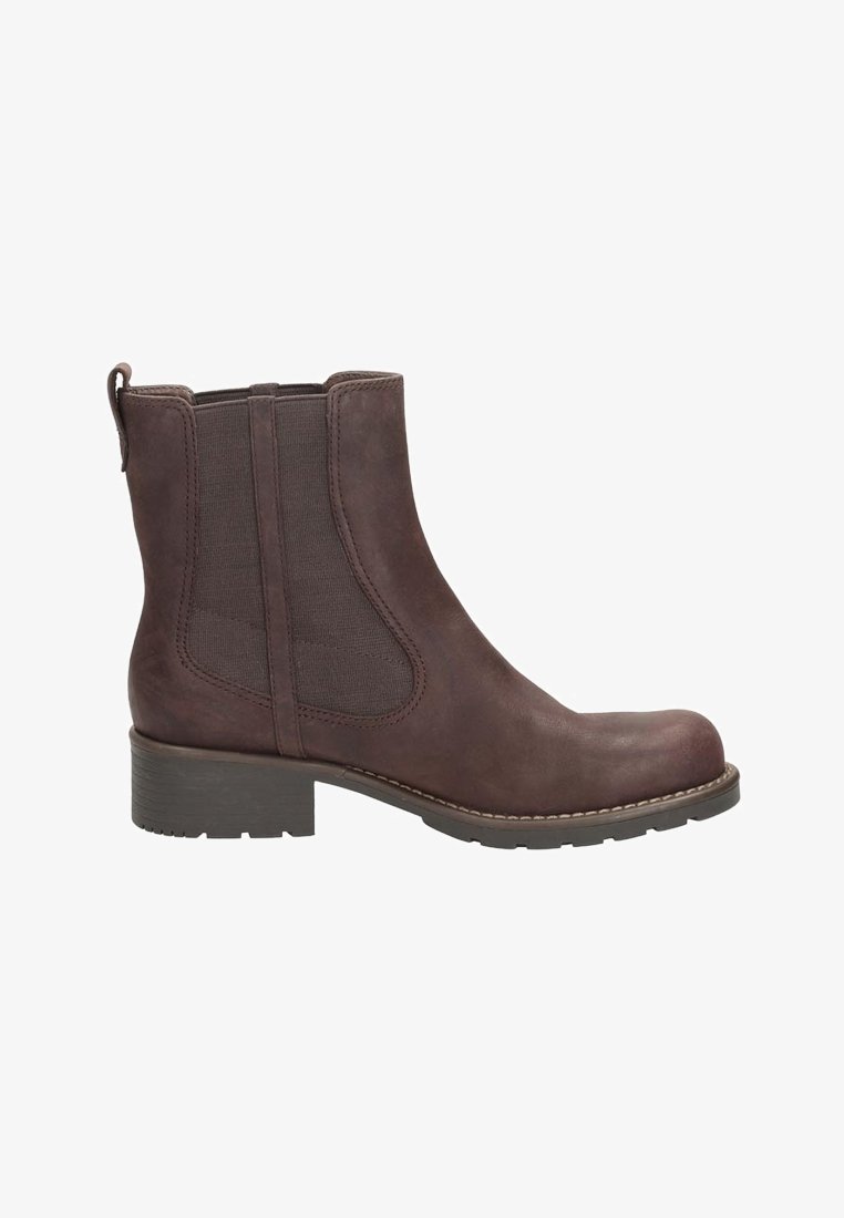 Bottine en cuir brun avec des panneaux latéraux élastiques, bout arrondi et un petit talon carré. Présente des coutures le long de la semelle pour plus de détails.